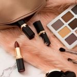 50s Fashion Makeup featuring red lipstick, winged eyeliner, defined eyebrows, and rosy cheeks