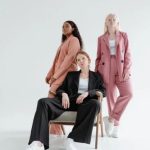 80s Preppy Fashion featuring pastel polo shirts, cable-knit sweaters, chinos, and classic loafers