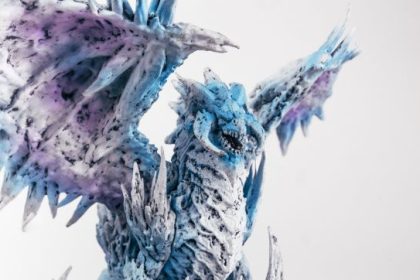 Gayfirir mystical fantasy creature with purple, blue, and green fur, golden eyes, intricate patterns, and an enchanted forest background