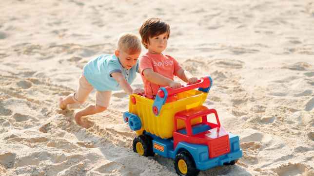 Sandlader toy loader for children playing with sand outdoors